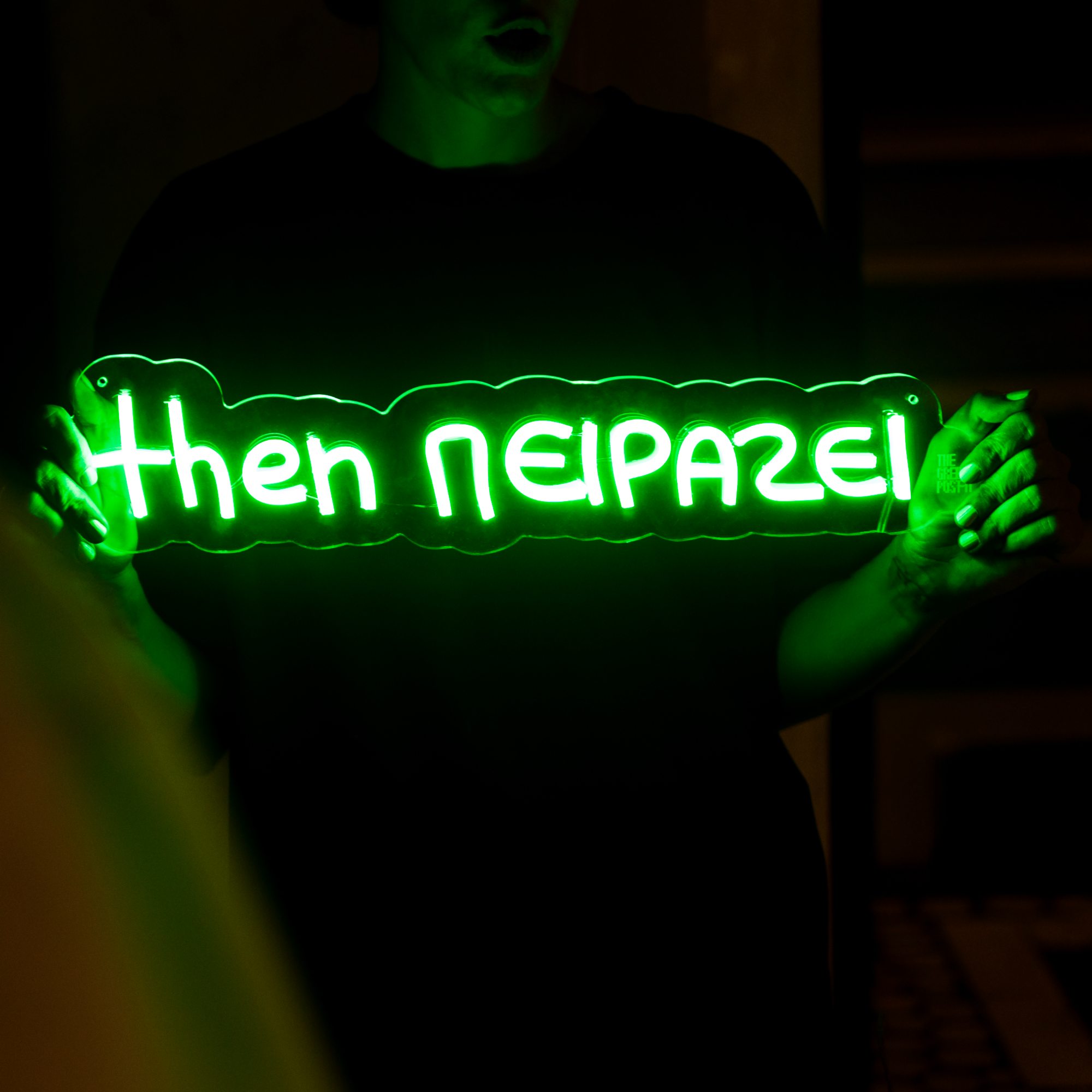 Neon sign ΄΄then πειράζει΄΄