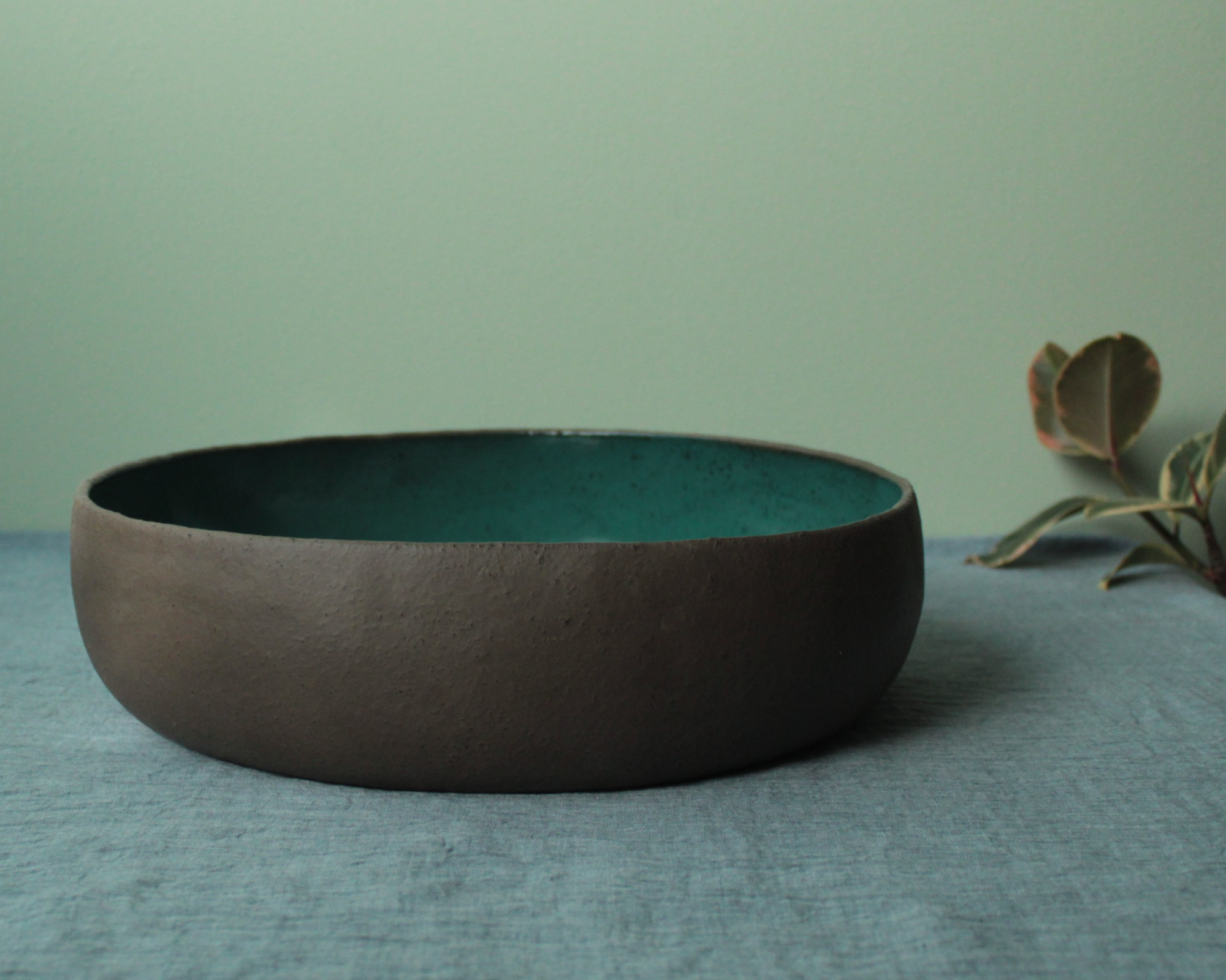 Brown bowl with botanical green glaze