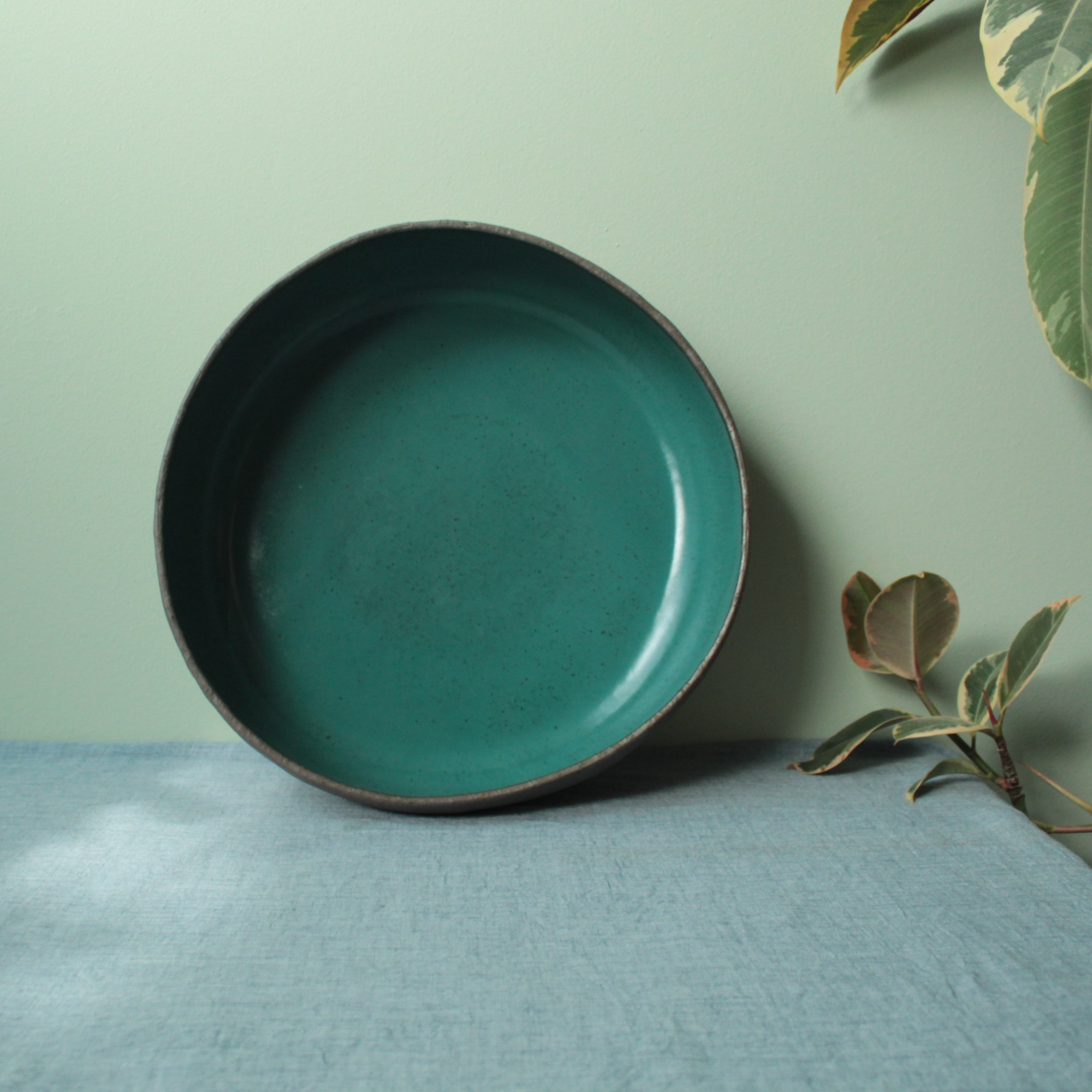 Brown bowl with botanical green glaze