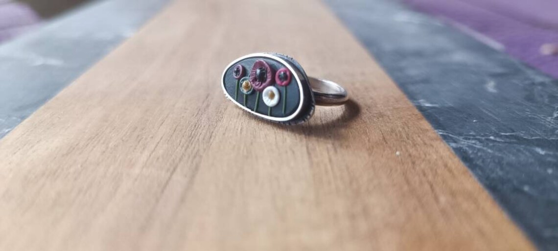 Ring of Poppies in black