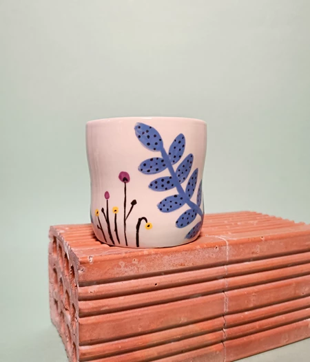 Floral ceramic mug with cute face