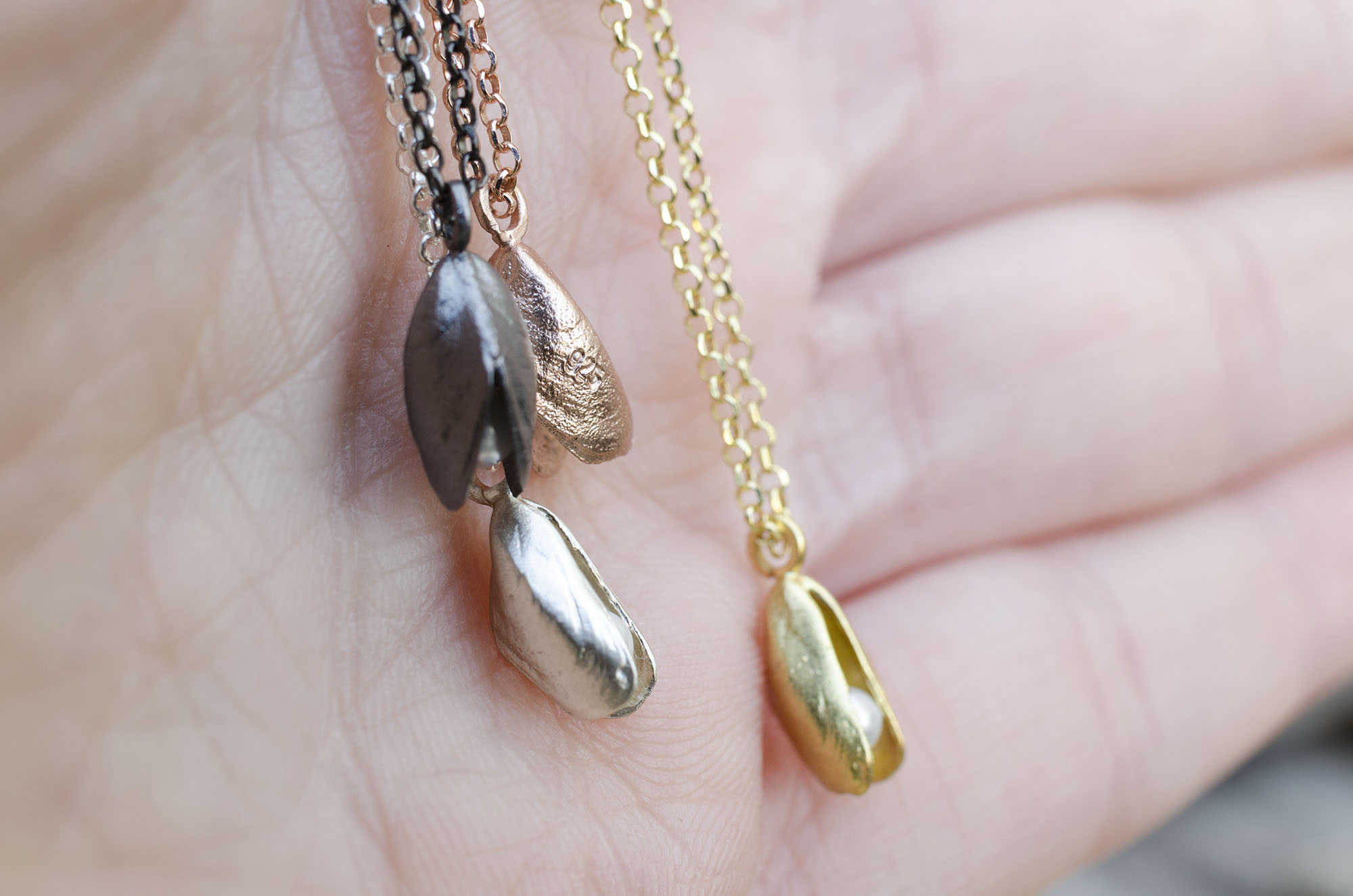 Tiny mussel pendant with pearl