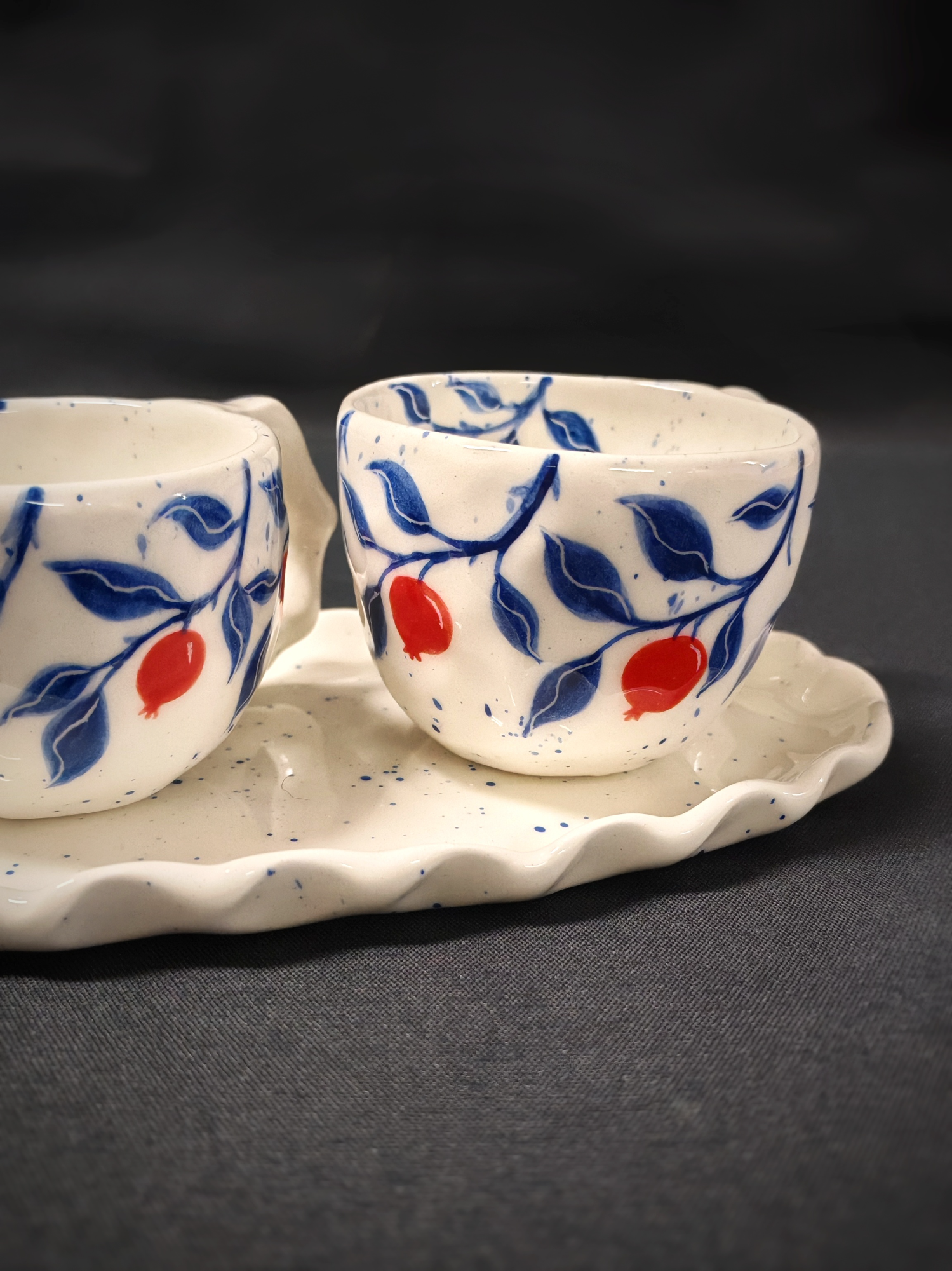 Set of 2 coffee cups with pomegranates and oval plate
