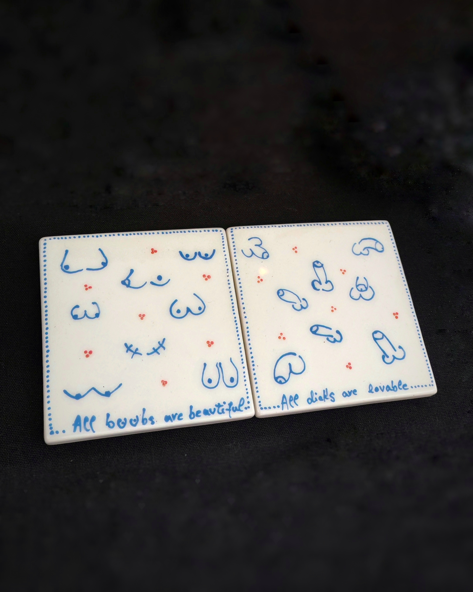 'All boobs are beautiful' and 'All dicks are lovable' coasters