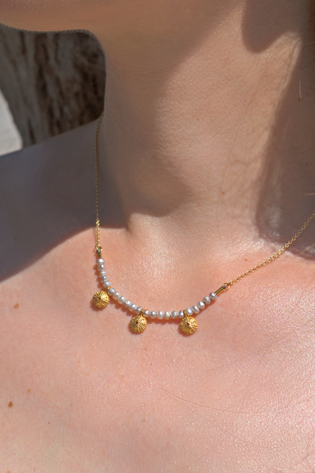 Sea urchin pendant with pearls
