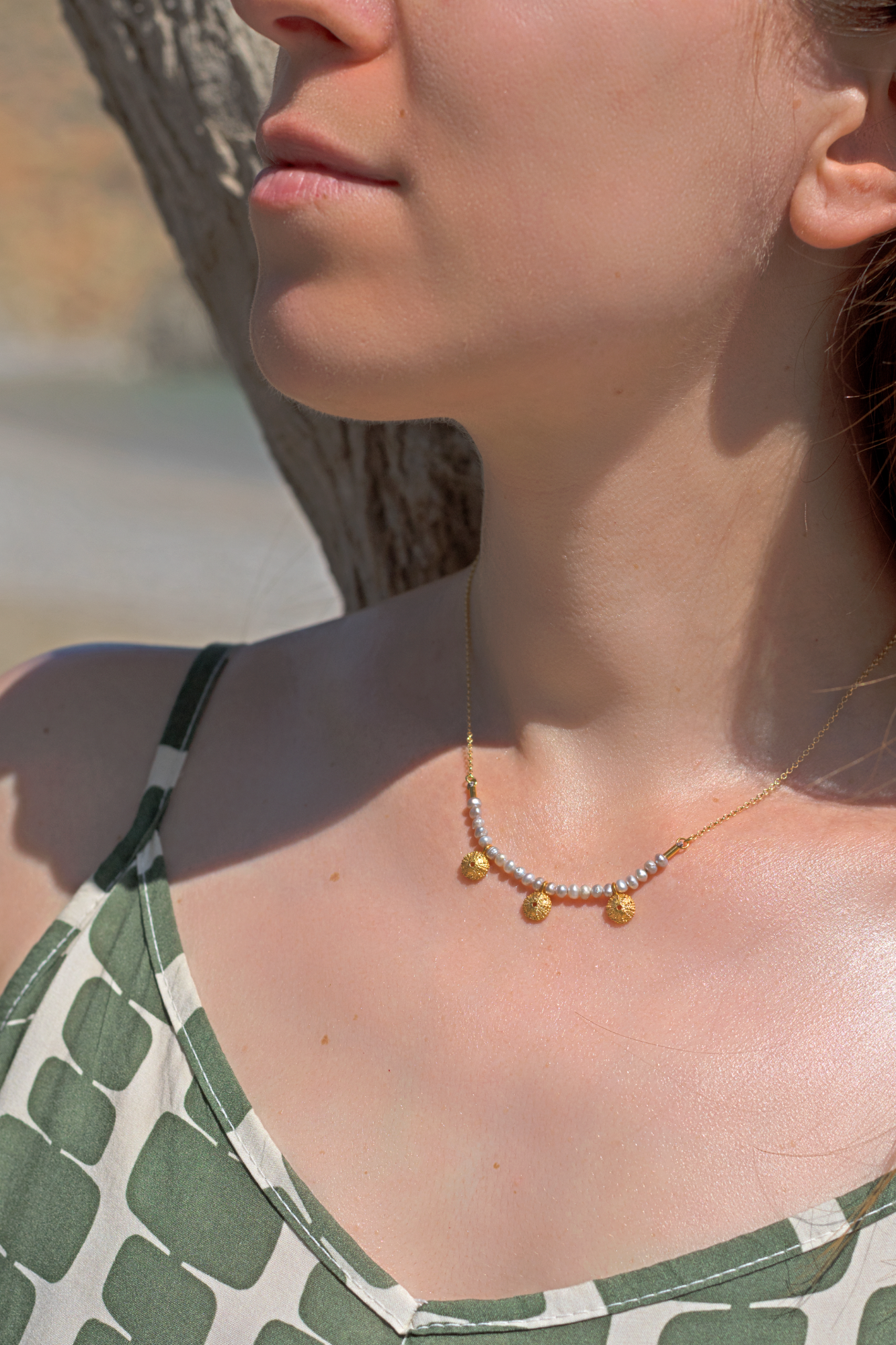 Sea urchin pendant with pearls
