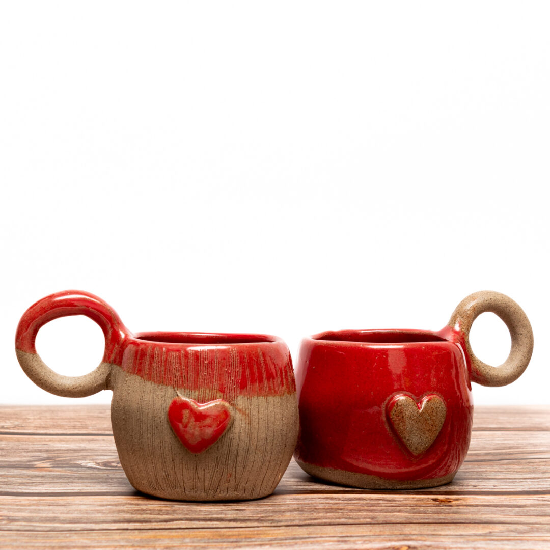 Handmade ceramic cup for tea full in love