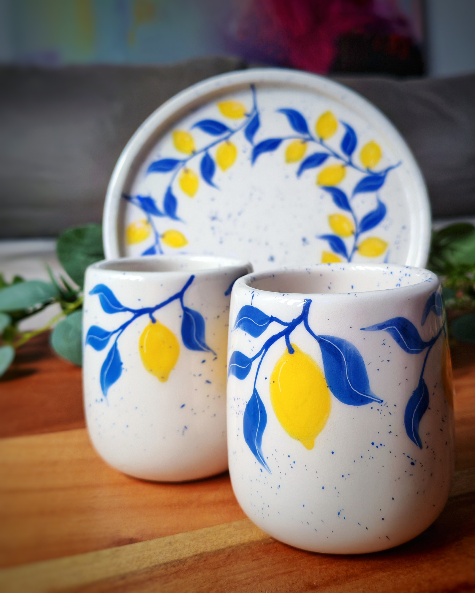 Two cups, one tray, and a little sunshine captured in clay.